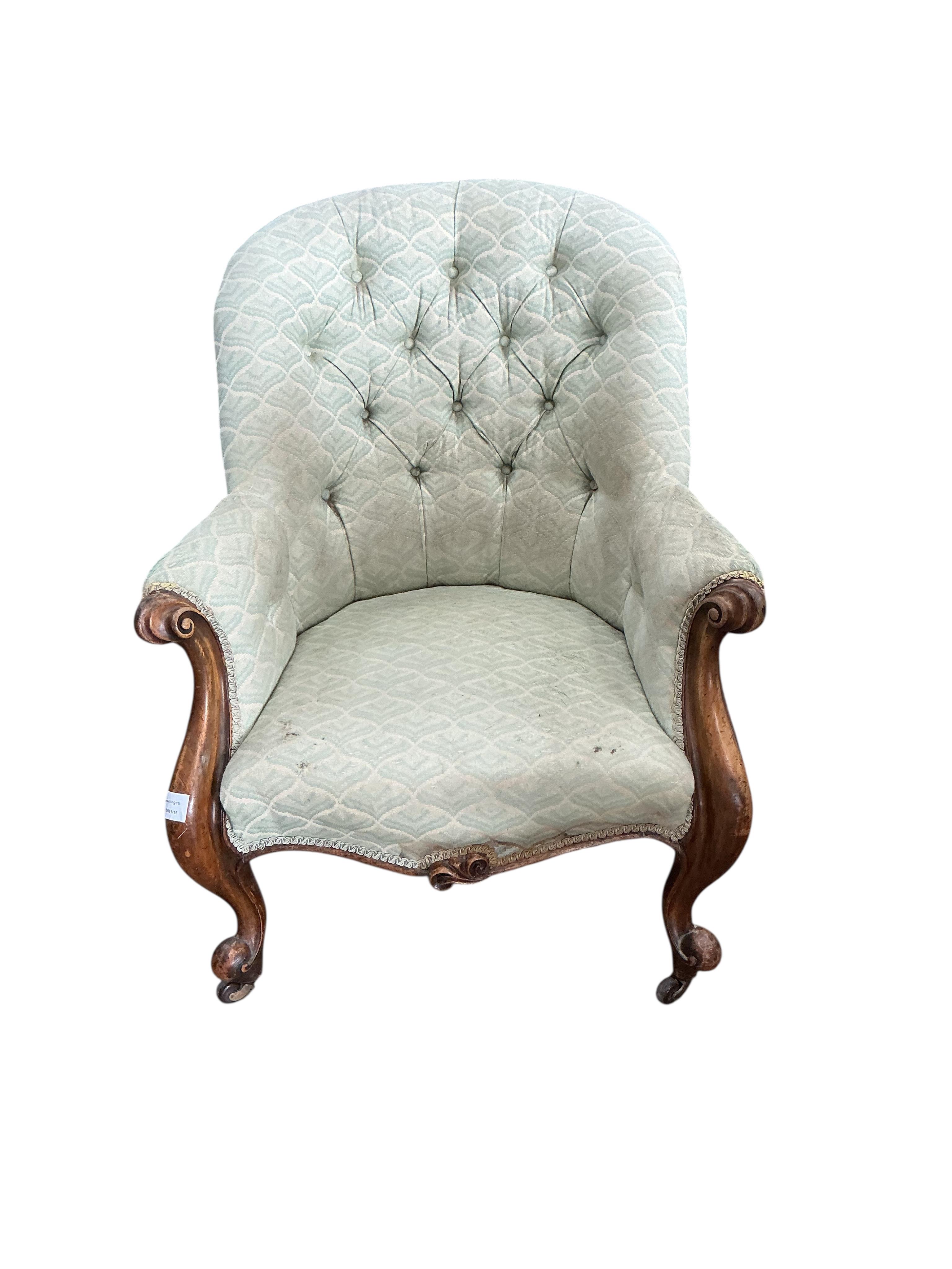 A Victorian mahogany upholstered spoon back armchair, width 72cm, depth 86cm, height 91cm